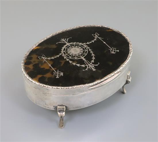 A George V silver and tortoiseshell pique oval trinket box, William Comyns, London, 1912, 15.2cm.